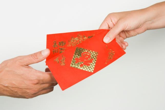 Chinese New Year Chinese kids get money in red envelopes (lai
