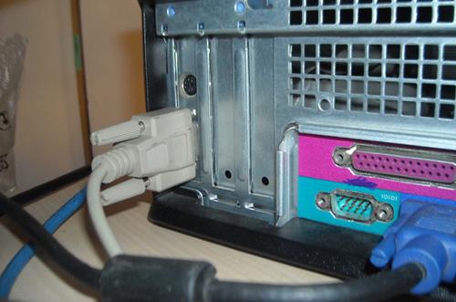 2. Remove the screws on the bottom side of the wiring box and lift off the wiring box cover, as shown in Figure 3. Figure 3 Removing the wiring box cover 3.