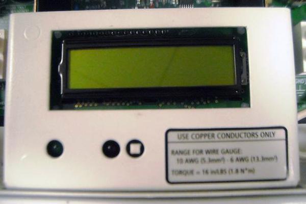 5. Press and release the white button beside the LCD. When released, the button should protrude further out than before. The button position is shown in Figure 5.