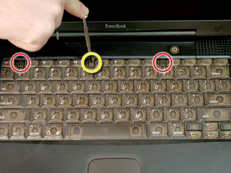 Step 1 Keyboard Turn the keyboard locking screw so that it is parallel to the space bar. Pull the keyboard release tabs toward you and lift up on the keyboard until it pops free.