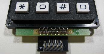 Insert the short pins of one -pin header through the board from the top and solder on the bottom; make sure that this header is as straight as possible.