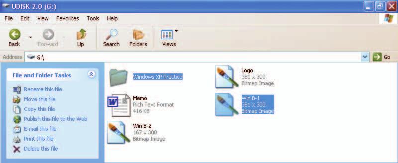 Up button FIGURE B-14: Dragging a file from one folder to another Common Tasks pane Your window might appear in another view When you drag a file to a new location, the file and location are