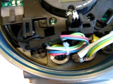 Arrange the cables so that they can't be damaged by the threads when mounting the housing cover. 20. Snap on the Display cover or the Label Display Cover (depending on the version). 21.