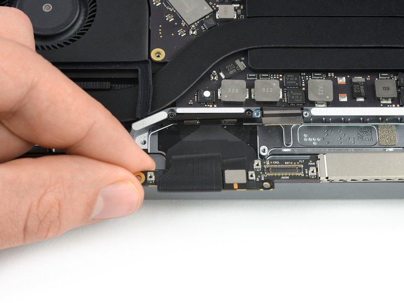 Use a pair of tweezers to pull the spring hinge of the display cable out of
