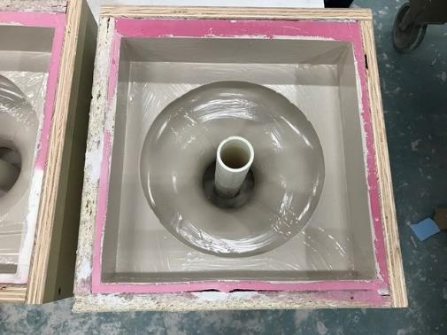 Microcotta being poured into a two part mold of the baluster