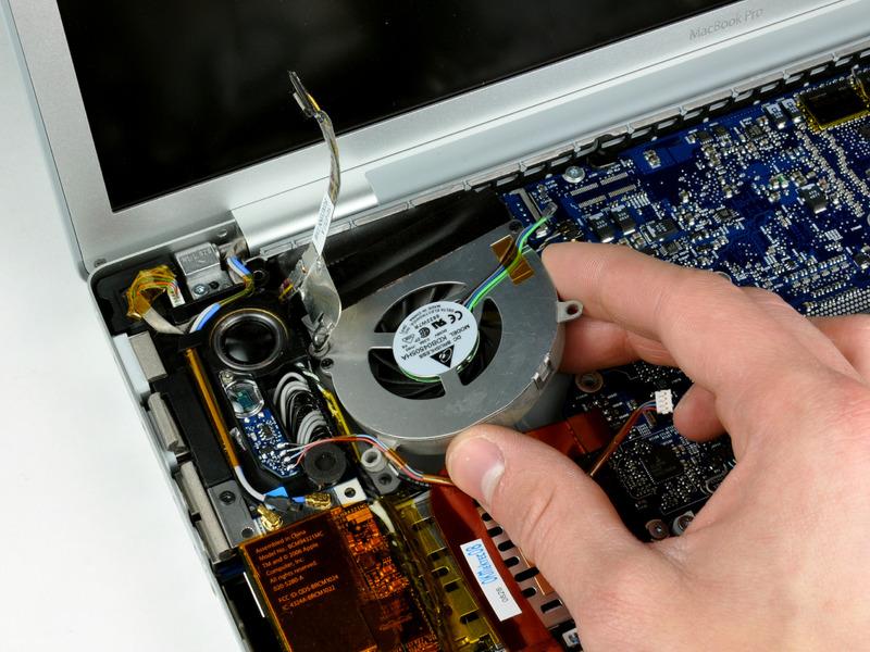 Lift the fan up; carefully peel up the tape that secures the fan to the heat sink as you go.