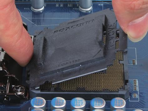 Step 4: Once the CPU is properly inserted, use one hand to hold the socket lever and use the other