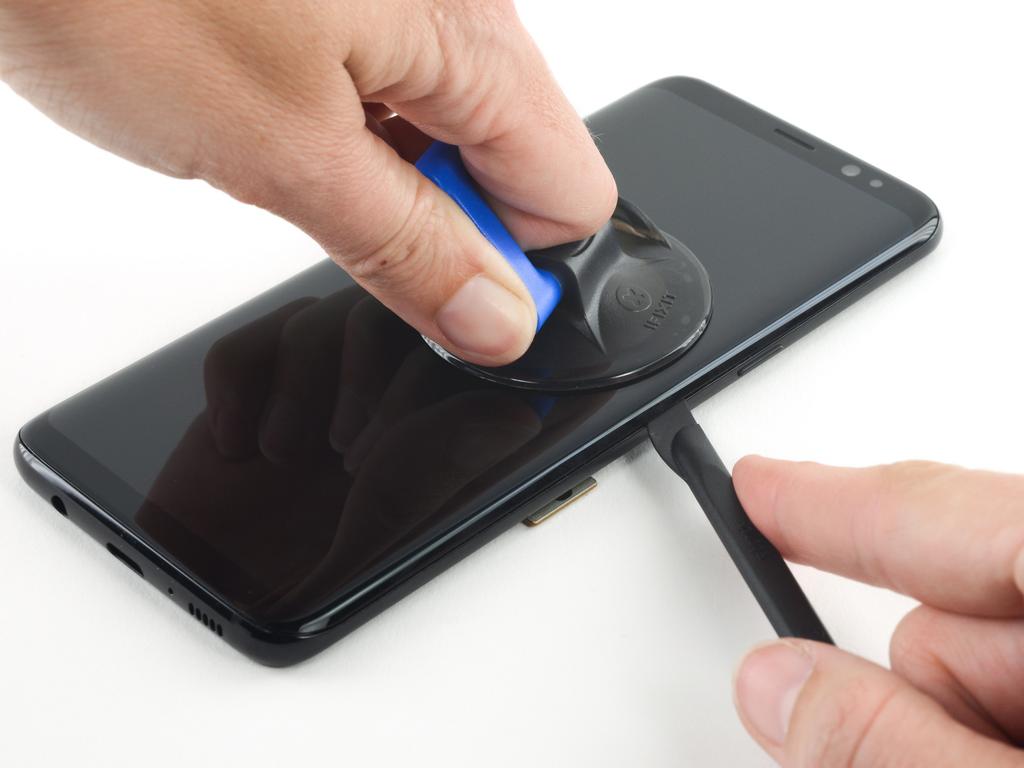 Step 17 Once the screen is warm to the touch, apply a suction cup as close to the heated edge of the phone as you can while avoiding the curved edge.