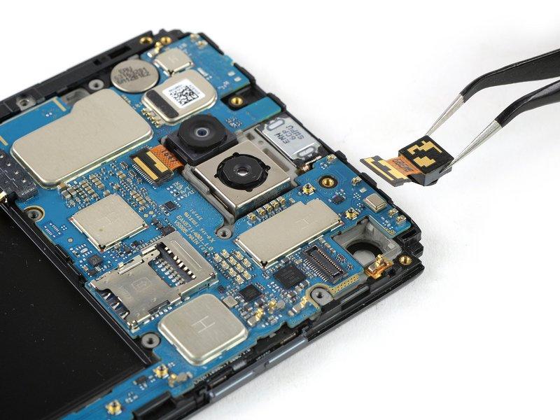If you want to go on and remove the motherboard assembly, there is no need to remove the front facing camera after