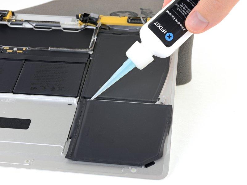 Step 41 Apply a few drops of adhesive remover along the top edge of the front right battery cell.