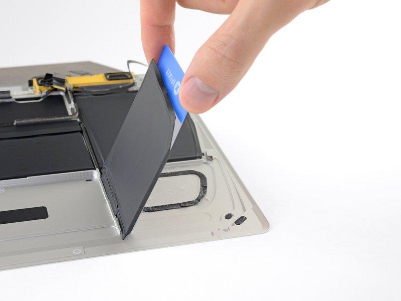 Leave the plastic card underneath the battery cell to prevent it from