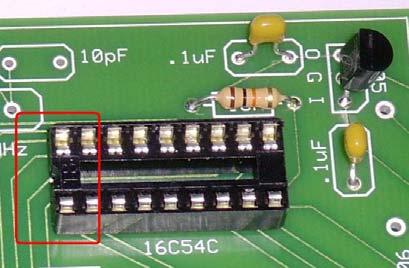 Hold the socket in place against the work surface and solder a single pin. Check that the socket is flush against the circuit board surface.