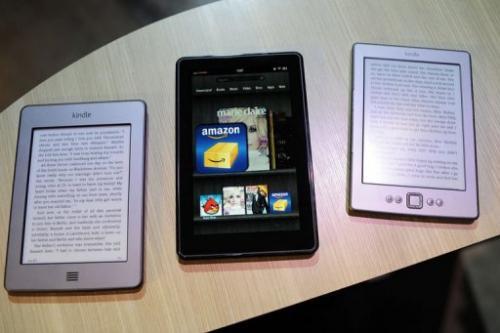 (AP Photo/Mark Lennihan) New Amazon Kindle products Kindle Touch (L), Kindle Fire tablet (C) and new Kindle are displayed at a press conference in New York.