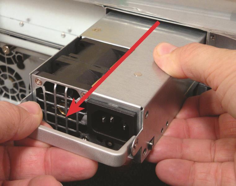 Gently pull the extraction handle and remove the PSU from the slot, supporting its weight