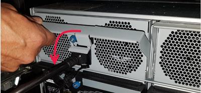 Chapter 1: Customer-Replaceable Units: Class 1 2. Fold down the extraction handle. Figure 1-32: Unlatching the PSU 3.