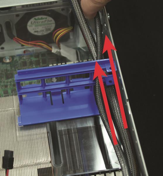 Unplug the FASTier data cables from the motherboard and slide them out of the plastic guides on top of the shelf.
