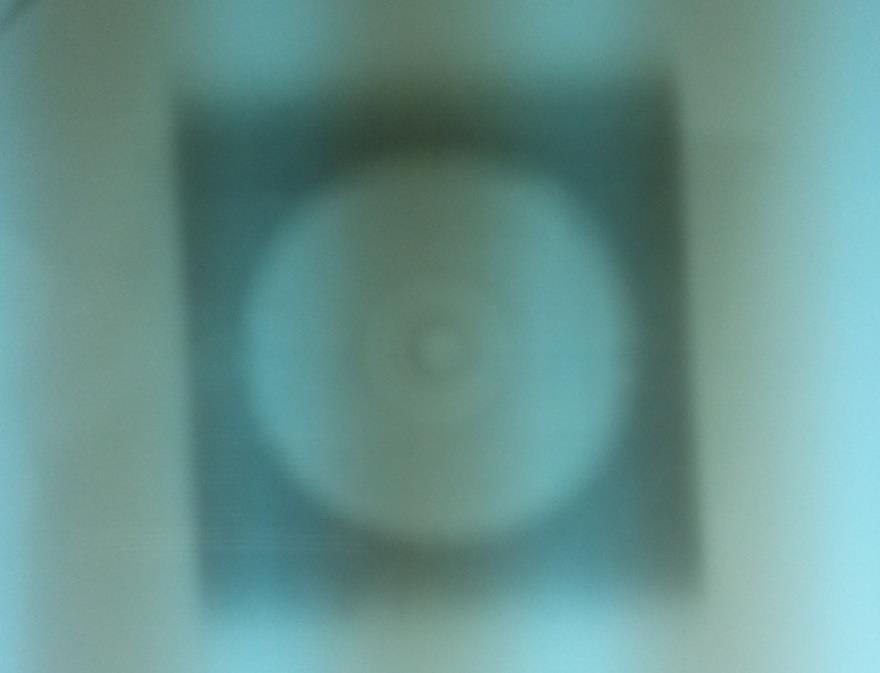 indicated by the black cross. Figure 2.7: Film of a well aligned mini-phantom.