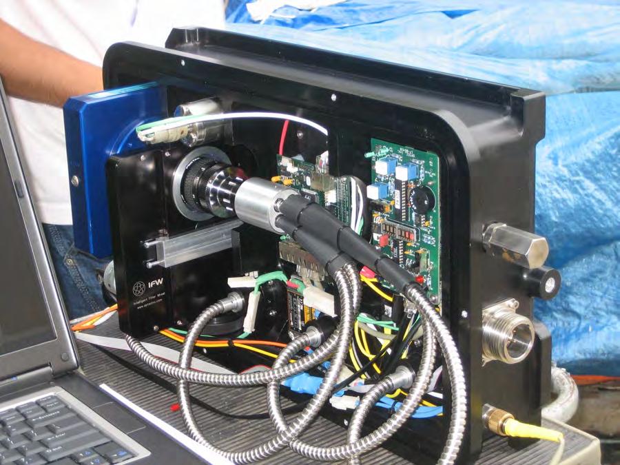 Figure 2. This is a picture of the interior of the polarization camera system. On the far left is the camera (the blue box), in front of which is the IFW filter chamber.
