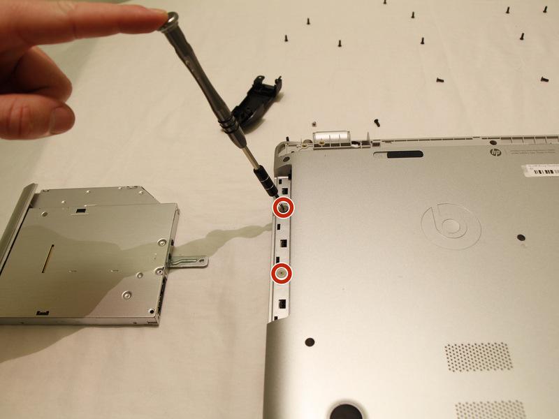 Step 7 Using a JIS #000 screwdriver, remove the two screws that were