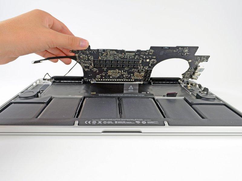 Step 30 Lifting from the side nearest the battery, rotate the logic board toward the top of the MacBook Pro.