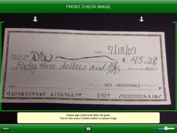 Deposit: Capture Front Check Image When taking an image of the check, placing the check on a dark background will help take a better image.