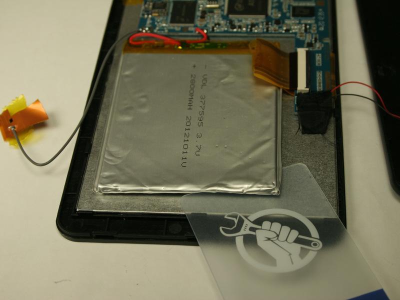 Step 5 Using a plastic card, gently break the adhesive that holds the battery