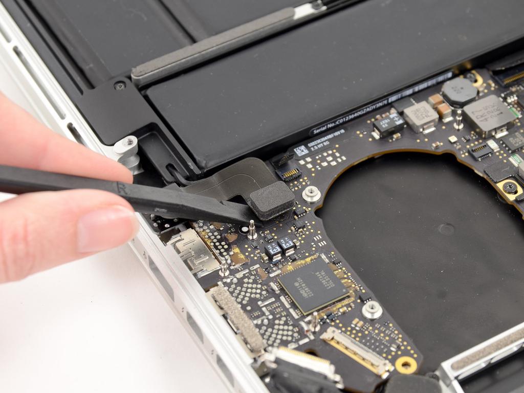 Pull the cable parallel to the face of the logic board.