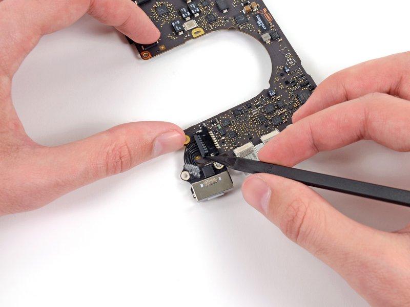Step 35 MagSafe DC-In Board Gently push the edges of the MagSafe