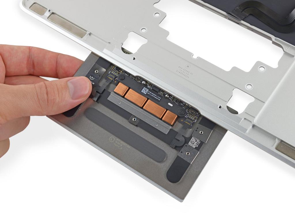 Metal brackets on each side of the trackpad may fall away during removal.