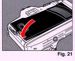 4. Close the Back Cover so that the Back Cover Latch snaps shut. (Fig. 21) If the film has been properly loaded, the film speed will first appear on the LCD Panel for about 2 seconds.