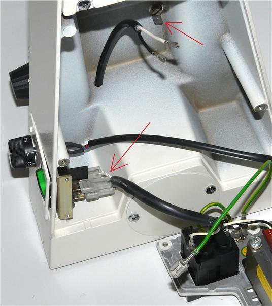 The photo c shows the tab on the ground connector to depress to remove it.