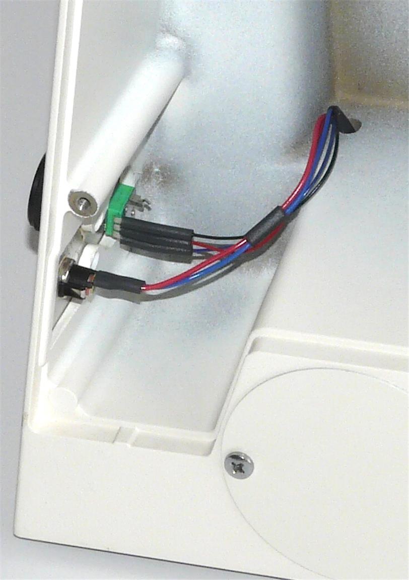 The larger light colored connector must be inserted first, then the smaller black connector.