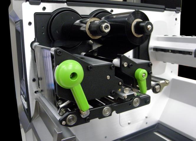 Close the print head mechanism by pushing the print head release lever.