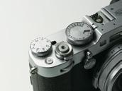 The shutter speed dial and the exposure compensation dial, made of milled metal for premium tactile quality, are knurled for added
