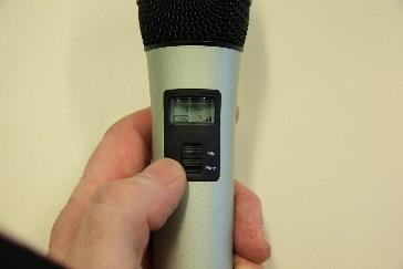Both the handheld mic and the lapel mic have Mute switches on them, to mute them while they are in use. The light turns yellow when the mic has been muted.