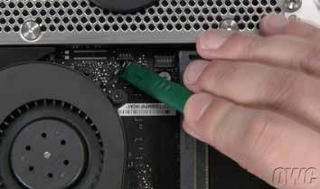 Use a nylon pry tool to lift up on the connector and detach it from the logic board.