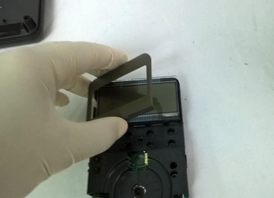 14. Place the LCD Cover over the LCD an