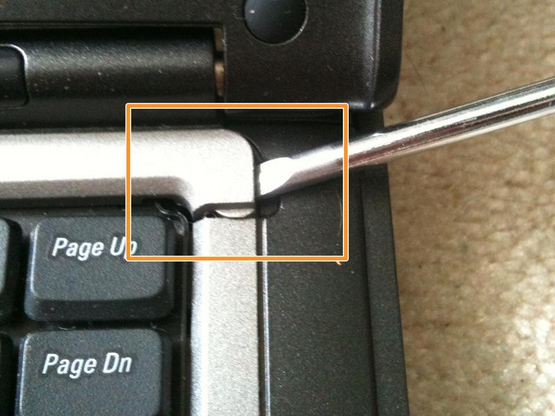 Step 1 Removing Keyboard Bezel Open the laptop's screen 180 Degrees so it