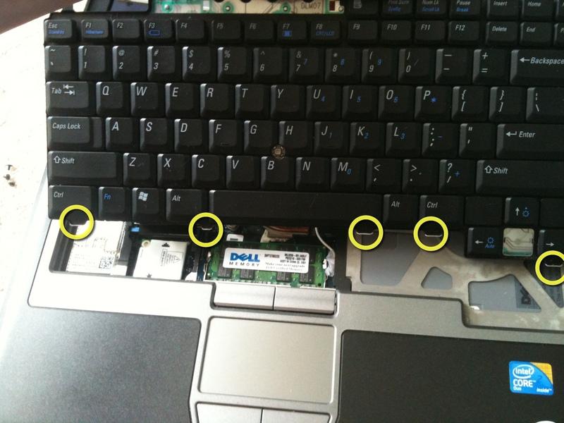 Carefully pull the keyboard upwards toward the LCD screen so it can be released from the bottom tabs.
