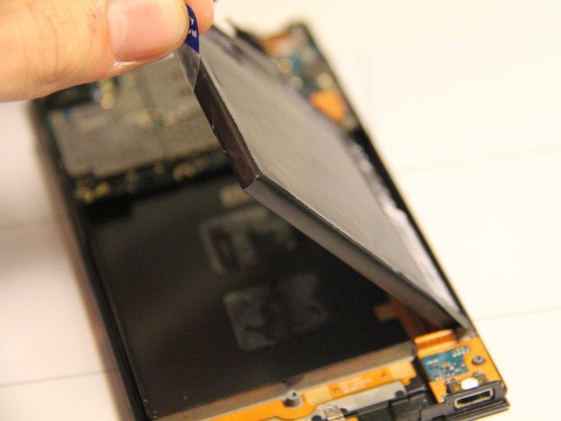 Lift up on the tab to remove the battery out of the panel.