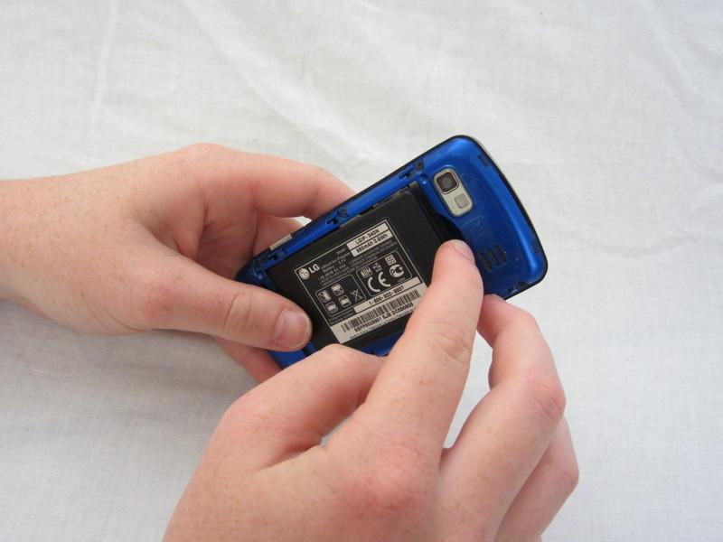 Step 3 Battery Using your index finger, pull the top of the