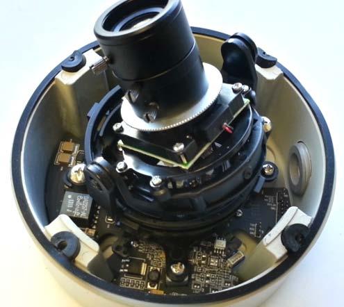 With the heater element facing away from the main board in the camera, align the two (2) holes on the heater board with the two holes on gimbal base shown in