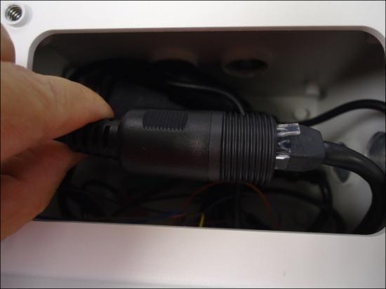 Connect the bundled power adapter and power cord and place them inside the junction box.
