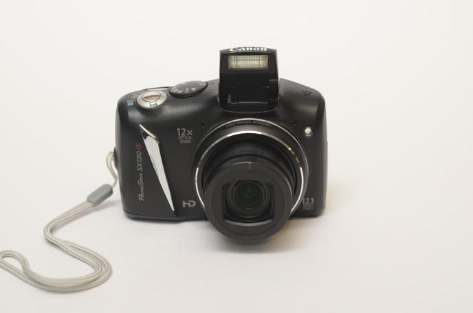 DCAM Canon SX130 IS 12 Megapixel Point & Click Camera Point & Click Camera Records.JPEG Files to an SD Memory Card* 1. Camera w/ Wrist Strap 2. Charger 3. USB Card Reader 4. 1 Manual 5.