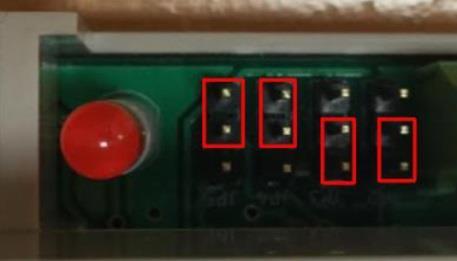 Programming jumpers to the right of the LED should be left in their