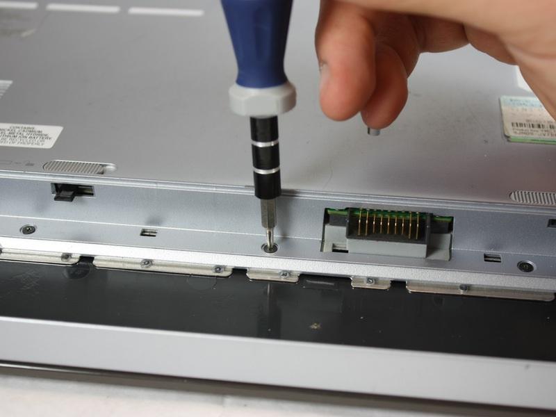 85mm screws inside the battery compartment.