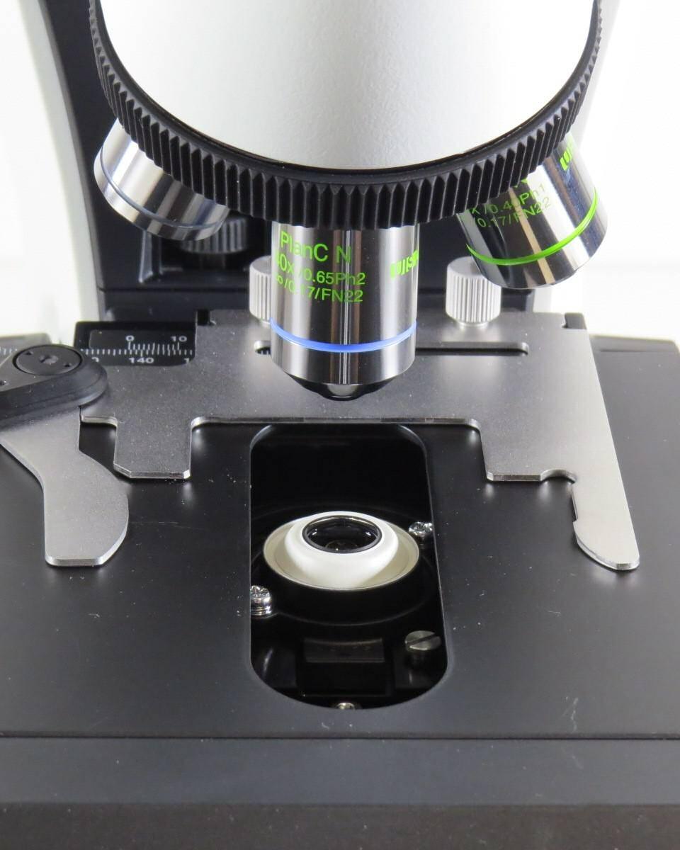 Microscope Stage X-Y slide control Phase Contrast adjusting knobs are found on both sides of the scope.