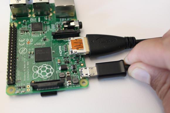 Plug USB power cable into the wall and into the Raspberry Pi to boot the