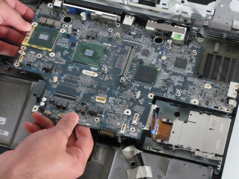 Step 18 Gently remove the motherboard from the laptop by simultaneously