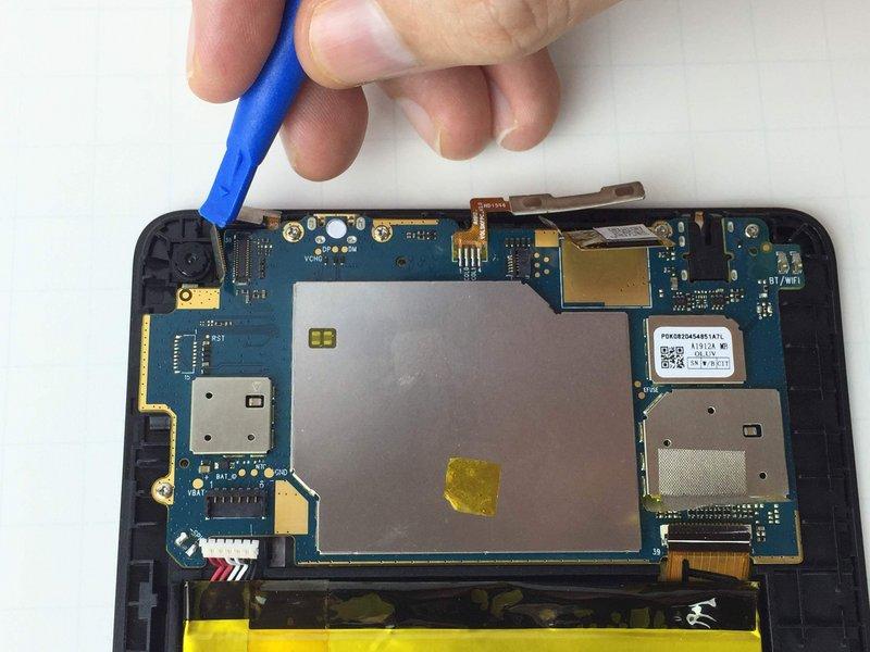 the ifixit Opening Tool beneath the connector